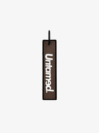 UNTAMED BROWN JET TAG